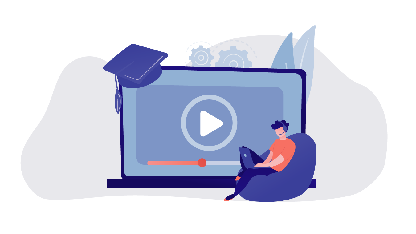 Someone sat on a bean bag, while using a laptop. Behind them is a large laptop with a play symbol on it.