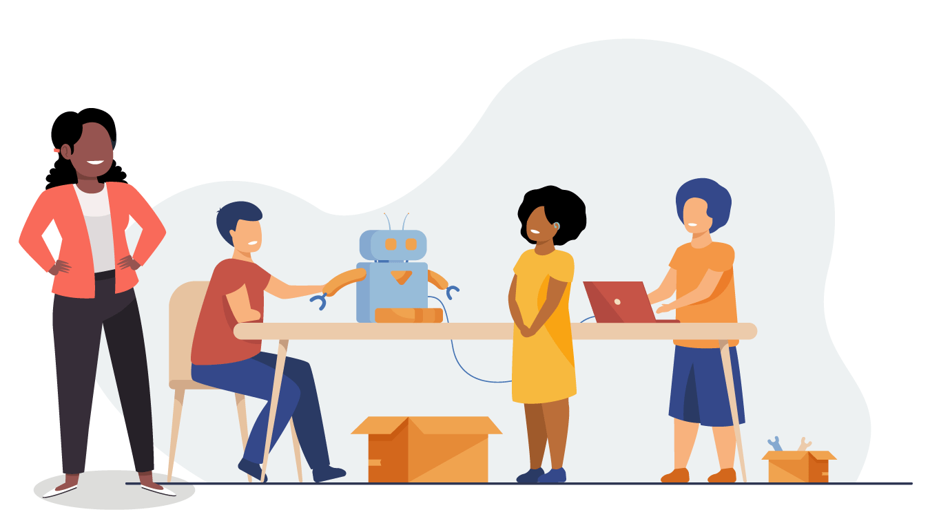 Three children working together on a project. One child is sat touching a robot that they're working on, while another child is using a laptop on the same table. An adult is standing near them, smiling.